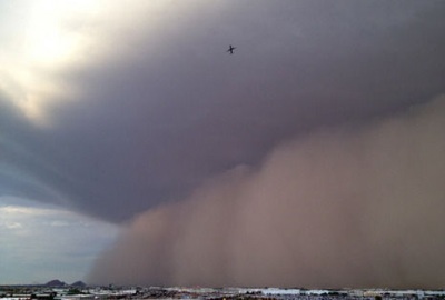 Phoenix - monster Monsoon on Monday Aug 26, 2013 - You can see a jetliner near the top - A jetliner soars safely above as a massive wall of dust hundreds of feet high rolls across the landscape