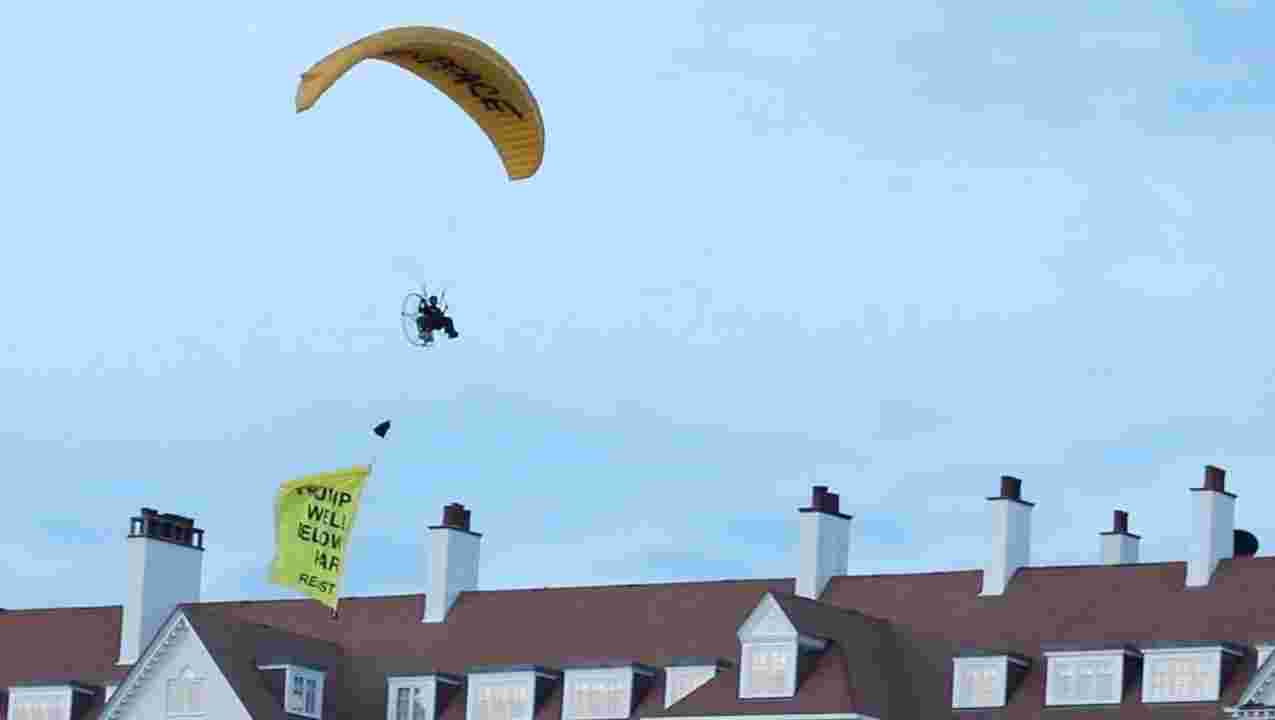 Paraglider Buzzes Emperor Trump in Scotland - Manhunt on for paraglider who flew banner over Trump during Scotland golf course visit